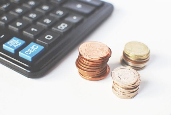 coins next to a calculator